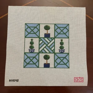 A square of squares with trees and flowers on them.
