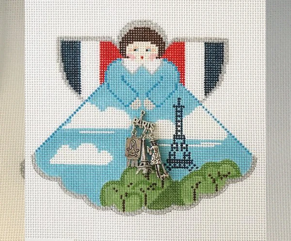 A picture of an angel with the eiffel tower in the background.