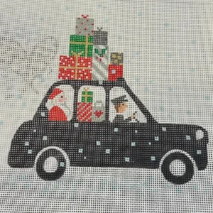 A black car with presents on top of it.