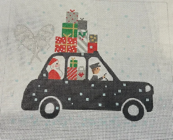 A black car with presents on top of it.