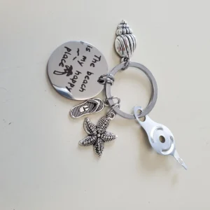 A key chain with shells and starfish on it.
