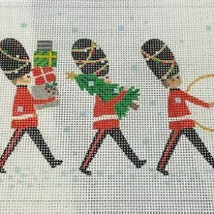 A group of people walking in the snow.