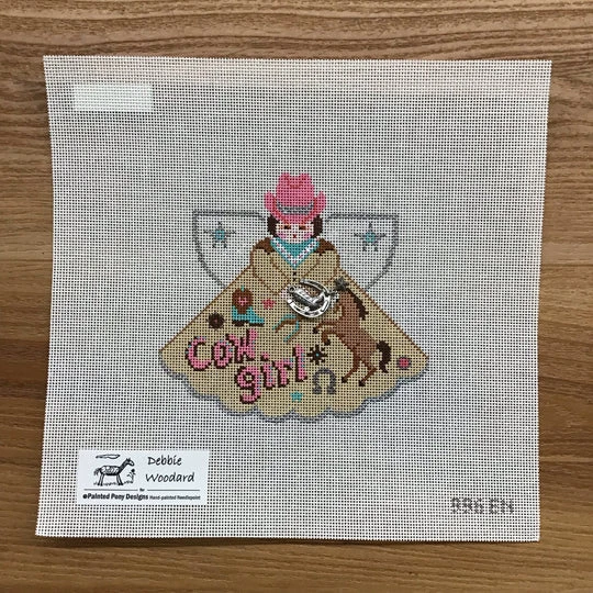 A picture of the cowgirl angel on a cloth.