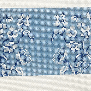 A blue and white floral pattern on fabric.