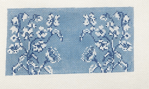 A blue and white floral pattern on fabric.