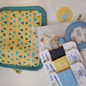 A small bag with some sewing supplies on it