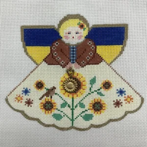 A cross stitch of an angel with flowers.