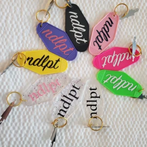 A group of different colored keys with the word " nplpt ".