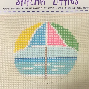 A cross stitch kit of a sailboat with the name stitchin ' littles.
