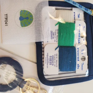 A blue case with some green and white thread