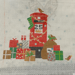 A red and white christmas mailbox with presents on it.