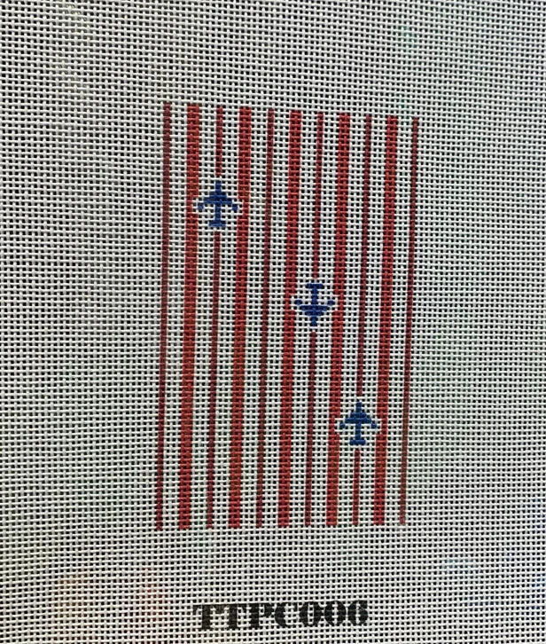 A red and white striped pattern with blue anchors.