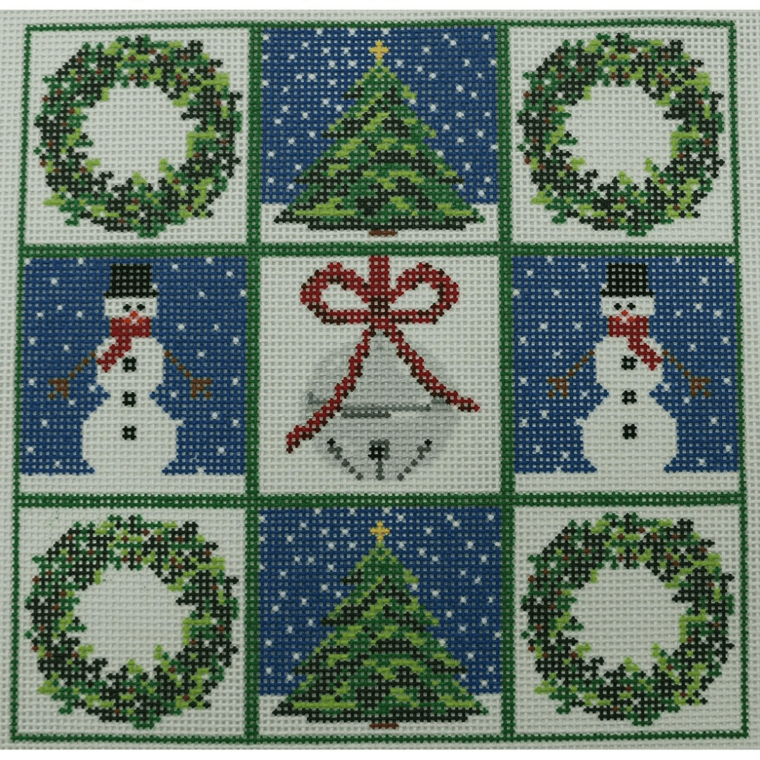 A square of christmas themed fabric with snowmen and trees.