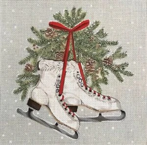 A pair of ice skates with a christmas tree hanging on the back.