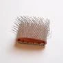 A close up of a comb on top of a table