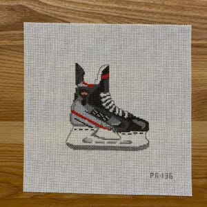 Gray and red ice skate needlepoint artwork