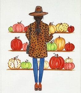 Person in leopard coat and hat viewing pumpkins