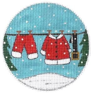 Santa suit hanging on clothesline in snow