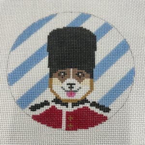 Cross-stitched dog in British guard uniform