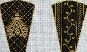 Two black and gold embroidered panels