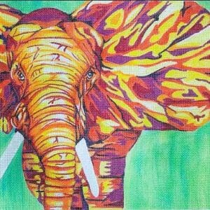 Colorful painted elephant head on green background