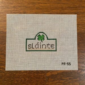 Needlepoint canvas with "sláinte" and shamrock