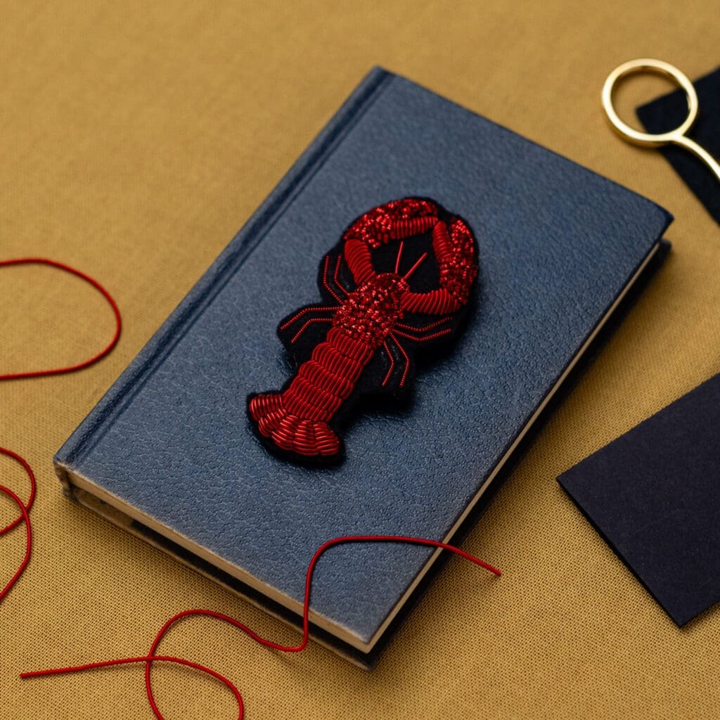 Blue notebook with red embroidered lobster