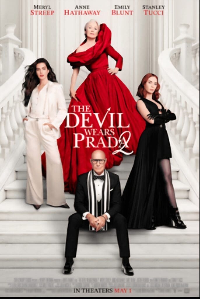 Four stylish people posing on white staircase