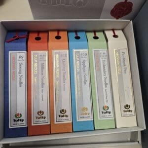 Row of colorful Tulip sewing needle boxes