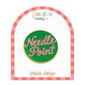 Green Needle Point enamel pin on card