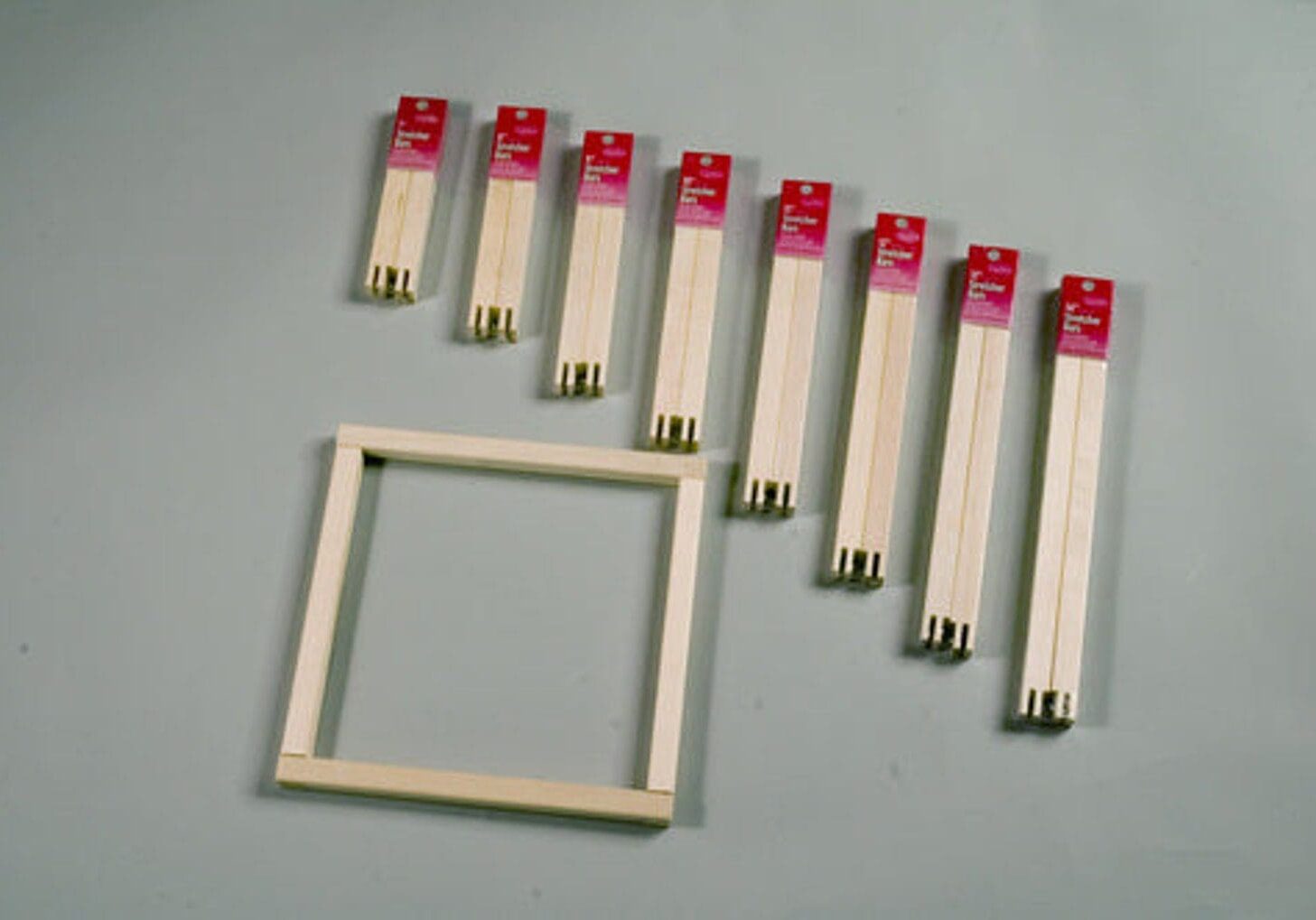 A group of chopsticks and a square frame.